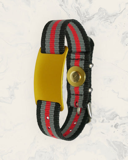 Natural Pain Relief and EMF Protection Bracelet Nylon Band Color Black, Gray, and Red Striped with a Gold Slider