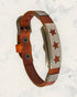 Frequency Jewelry Natural Pain Relief and EMF Protection Bracelet Leather Band Color Burnt Orange with a Star design on a silver metal slider